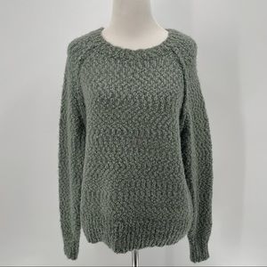 Yet Again Woman’s Green Sweater